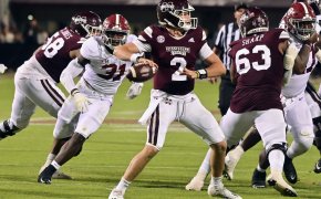 Mississippi State Bulldogs quarterback Will Rogers throws a pass against Alabama Crimson Tide linebacker Will Anderson Jr.