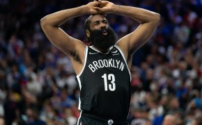 James Harden hands over head, breathing out in pain