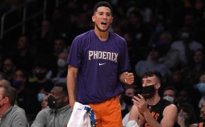 Devin Booker fist pump on the bench