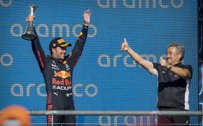 Red Bull Racing Honda driver Sergio Perez celebrating a podium finish