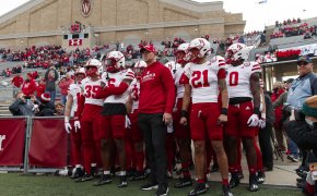 Nebraska Cornhuskers head coach Scott Frost waits with the football team before taking to the field