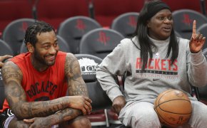 Houston guard John Wall and assistant coach Barbara Turner sitting together before a game