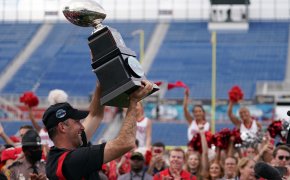 Western Kentucky Hilltoppers head coach Tyson Helton celebrates with the trophy