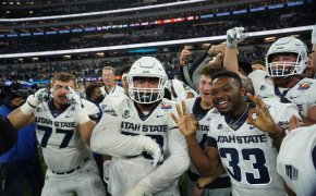 Utah State Aggies players celebrate after the game against the Oregon State Beavers