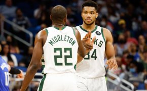 Giannis Antetokounmpo and Khris Middleton give each other five