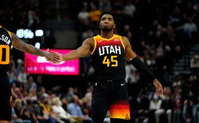 Donovan Mitchell gives five to teammate