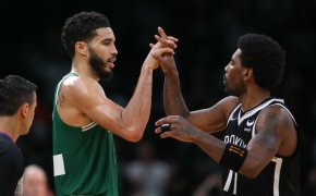 Jayson Tatum and Kyrie Irving high five each other