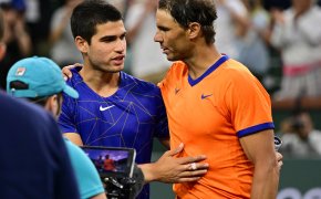Rafael Nadal talking to Carlos Alcaraz
