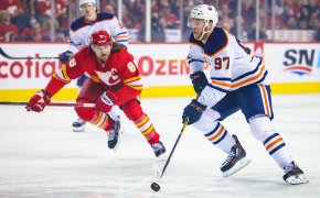 Edmonton Oilers center Connor McDavid carrying the puck up the ice vs Calgary