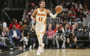 Atlanta Hawks Trae Young dribbling the ball up the court during a game.