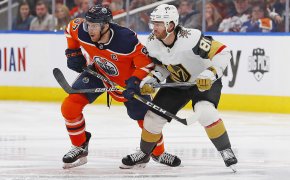 Edmonton Oilers forward Connor McDavid and Vegas Golden Knights forward Jonathan Marchessault battle for a loose puck