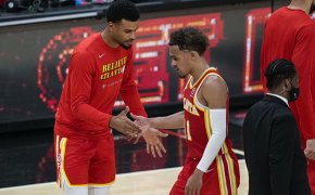 Trae Young high fives teammate