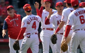 Los Angeles Angels starting pitcher Shohei Ohtani high fiving teammates