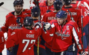 Washington Capitals players celebrating a playoff win over the Florida Panthers