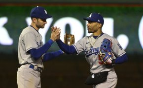 Los Angeles Dodgers shortstop Trea Turner and right fielder Mookie Betts high-fiving