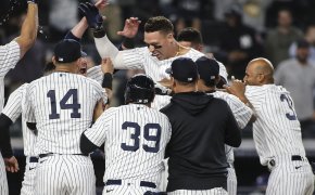 New York Yankees center fielder Aaron Judge is mobbed by teammates after a walk-off home run