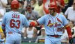 St. Louis Cardinals third baseman Nolan Arenado congratulating shortstop Edmundo Sosa at home plate