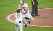 Baltimore Orioles designated hitter Adley Rutschman celebrating with left fielder Austin Hays after scoring a walk-off run