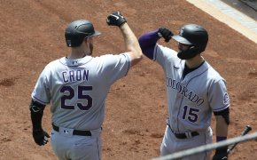 Colorado Rockies first baseman C.J. Cron elbow bumping with right fielder Randal Grichuk after hitting a homer