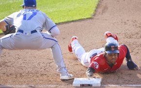 Cleveland Guardians designated hitter Jose Ramirez diving back into first base