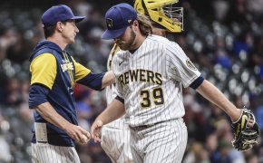 Milwaukee Brewers manager Craig Counsell takes the ball from pitcher Corbin Burnes