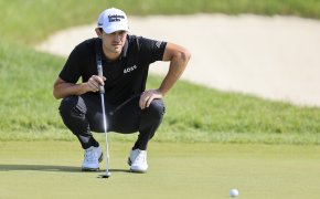 Patrick Cantlay lines up a putt