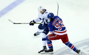 Rangers and Lightning players collide during the NHL Stanley Cup Playoffs.