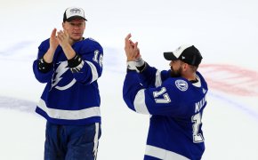 Two Lightning players celebrate advancing to the NHL Stanley Cup Finals.