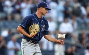 Tampa Bay Rays starting pitcher Shane McClanahan flipping a rosin bag