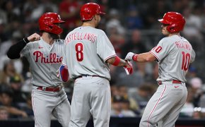 Phillies players celebrate after JT Realmuto hits a home run.