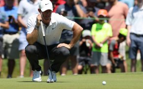 Rory McIlroy looks over a putt