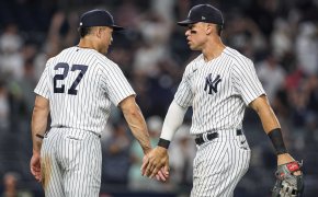 New York Yankees center fielder Aaron Judge high-fives designated hitter Giancarlo Stanton