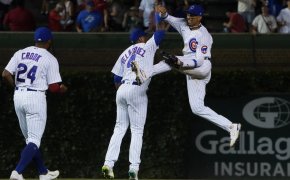 Cubs players celebrate after a win.