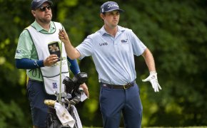 J.T. Poston grabs a club in the third round of the John Deere Classic