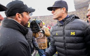Ohio State coach Ryan Day shakes hands with Michigan coach Jim Harbaugh