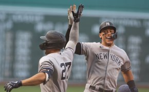 Aaron Judge congratulates left fielder Giancarlo Stanton on his two-run home run during the second inning against the Boston Red Sox