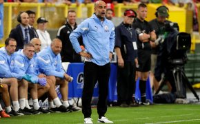 Manchester City manager Pep Guardiola on his team's sideline