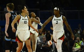 Kelsey Plum and Riquna Williams give each other five