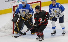 Team Canada forward Connor Bedard looks for a pass