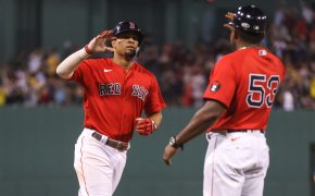 Xander Bogaerts about to high-five teammate