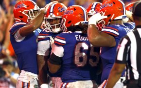 Florida Gators quarterback Anthony Richardson is congratulated by teammates after scoring touchdown