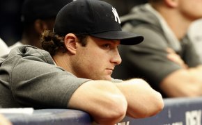 New York Yankees pitcher Gerrit Cole watches from the dugout