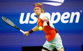 Andrey Rublev hitting a forehand shot during a tennis match.