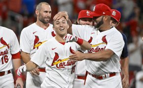 St. Louis Cardinals shortstop Tommy Edman is congratulated by teammates after hitting a game-winning double