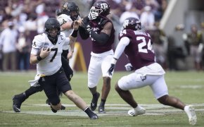 App State Mountaineers quarterback Chase Brice rushes against Texas A&M Aggies linebacker Chris Russell