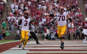 USC offensive lineman Bobby Haskins points at wide receiver Jordan Addison after scoring a touchdown