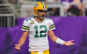 Aaron Rodgers arms out