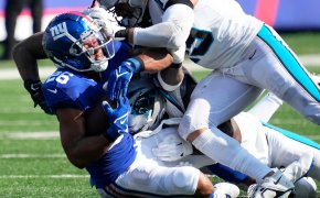 Saquon Barkley is driven into the ground