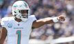 Miami Dolphins quarterback Tua Tagovailoa calls a play at the line
