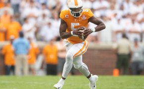 Tennessee quarterback Hendon Hooker scrambles with the ball